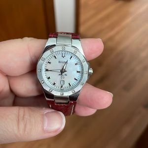 Womens Miss Marine Bulova watch. MOP dial, date marker, diamonds at hour marks.